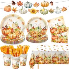 a table topped with plates covered in fall decorations