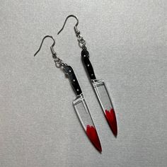 *Please read before purchasing!* Large knife earrings made with resin and hand painted details. Length of the knife portion is approximately 2.5 inches long. Last photo compares the size of the mini and large knives. All earrings are made with hypoallergenic (nickel free) silver findings and have fish hook earring wires.  Other important information: - resin pieces naturally have micro bubbles or spots where air bubbles have popped - no two resin pieces are alike / restocks of these pairs will be different than the photos - FINAL PRODUCT MAY DIFFERENTIATE IN COLOR FROM PHOTOS Resin Knife, Knife Earrings, Weird Jewelry, Edgy Jewelry, Tempe Az, Earring Wires, Animal Rings, Fish Hook Earrings, Funky Jewelry