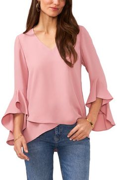 A breezy tulip-front tunic with a flattering V-neck is framed by cascading flutter sleeves for a light and romantic look. 25" front length; 27" back length (size Medium) 100% polyester Lined front Machine wash, tumble dry Imported Flutter Sleeve Blouse, Dressy Blouse, Sleeves Designs For Dresses, Chic Blouses, Designs For Dresses, Dressy Tops, Dillard's, Flutter Sleeves, Designer Wear