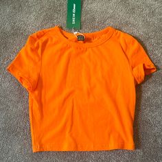 Never Worn, Has Tags, No Rips Or Stains, Comes From A Smoke Free Home Orange Stretch Crop Top With Short Sleeves, Basic Plain Crop Top For Spring, Fitted Orange Casual T-shirt, Orange Short Sleeve Casual Crop Top, Trendy Orange Short Sleeve Crop Top, Casual Orange Short Sleeve Crop Top, Basic Orange Tops For Summer, Fitted Orange T-shirt For Spring, Orange Crop Top