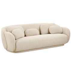 a white couch with four pillows on it