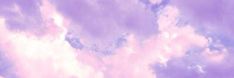 the sky is filled with clouds and purple hues in shades of blue, pink, and white