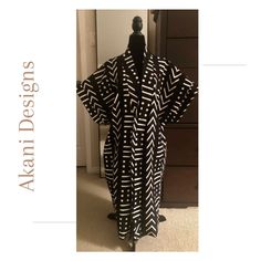 Take your style to another level with this beautiful African Print Kimono.  This tribal print kimono can be dressed up or worn casually with jeans or leggings.  It can also be worn as a swimsuit cover up.  Made with African wax cotton or mixed fabric  Loose fitting with side pockets  42 inches long with short sleeves  The ankle length option is 52 inches  Comes in one size that can accommodate s-xxl Serged hem Please note that print size may vary.  Wash by hand or machine wash with delicates  Ha Fitted Black Kimono For Beach, Black Printed Kimono With Kimono Sleeves, Black Long Kaftan One Size, Black Long Printed Kimono, Black Printed Long Kimono, Black Printed Kaftan With Kimono Sleeves, Long Black Printed Kimono, African Outfits For Women, African Kimono