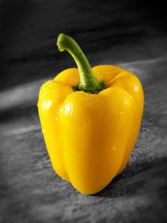 a yellow pepper sitting on top of a counter