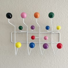 PRICES MAY VARY. Glossy solid wood balls with powder coated steel wire 14 hooks, overall dimension 19 in. L x 15 in. W x 5 in.D Hand made, Color arrangement of the balls might not be the same as pictured No assembly needed Practical and modern design for any interiors: entry way, living room, dining room, children's room, office etc. Cute Furniture For Living Room, Alternative Decor Home, Quirky Room Decor Retro Vintage, Playful Home Decor, Retro Maximalist Decor, Clowncore Decor, Pop Art Room Decor, Cool Living Room Decor, Fun Bedroom Decor