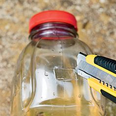 a bottle filled with liquid and a pair of scissors