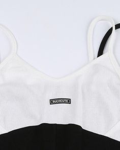 Details: Bodysuit with black and white contrasting colorBottom Length: ShortSleeve Length: SleevelessMaterials:95% Polyester + 5% Spandex Fitted White Tank Top With Contrast Trim, White Fitted Tank Top With Contrast Trim, White Color Block Tank Top For Summer, Black Color Block Tank Top For Summer, Casual White Color Block Tank Top, White Sleeveless Tank Top With Contrast Stripes, Black Sleeveless Color Block Tank Top, Casual White Tank Top With Contrast Stripes, White Sleeveless Color Block Tank Top