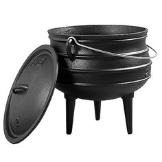 an outdoor cooking pot with lid and legs