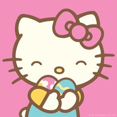 a hello kitty holding an easter egg