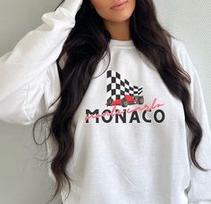 The Monaco Grand Prix Monte Carlo Racing Sweatshirt is printed on a Gildan 18000 brand crewneck- the ultimate fusion of comfort and style for all racing enthusiasts and trendsetters alike! 🏁 🏆 The vintage style design showcases the rich history of the Monaco Grand Prix .🏁 🌟 Crafted from a blend of 50% cotton and 50% polyester, this sweatshirt is pre-shrunk, ensuring it maintains its perfect fit wash after wash.  🏁 A Glimpse into History: The Monaco Grand Prix, an institution in the world of Racing Style Crew Neck Sweatshirt For Streetwear, Racing Style Letter Print Top For Sports Events, Racing Style Top With Letter Print For Sports Events, Racing Style Tops With Letter Print For Sports Events, Sporty Tops With Letter Print For Motorsport Events, Casual White Tops For Motorsport Events, Casual Crew Neck Tops For Motorsport Events, Long Sleeve Racing Top With Graphic Print, Racing Style Tops For Motorsport Events