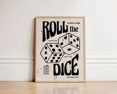 a poster on the wall that says roll the dice and has two black dots in it