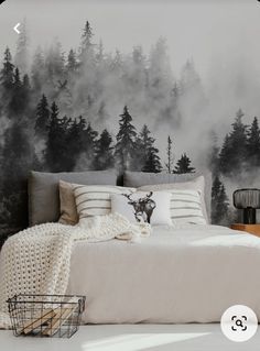 a bedroom with a deer head on the wall and fog in the trees behind it