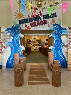 an entrance to a beach themed restaurant with buckets on the floor and decorations hanging from the ceiling