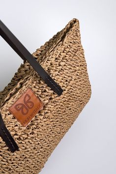 Embark on a journey of coastal elegance with our stunning Aria woven raffia tote, embodying the essence of Mediterranean living. Meticulously handcrafted with detailed raffia weaving and featuring sturdy brown handles, this tote exudes an aura of refined sophistication. Embrace the enchanting spirit of the Mediterranean with this indispensable accessory, a harmonious fusion of craftsmanship and style destined to captivate admirers. Details: Height: 14" Width: 18" Authentic raffia Handmade product. Raffia Weaving, Mediterranean Living, Italy Gift, Coastal Elegance, Woven Raffia, Comfortable Sneakers, Flat Sneakers, The Mediterranean, Espadrilles Wedges