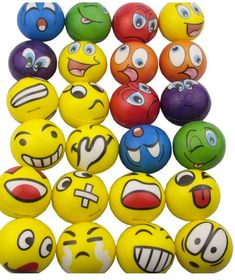 many different colored balls with faces on them