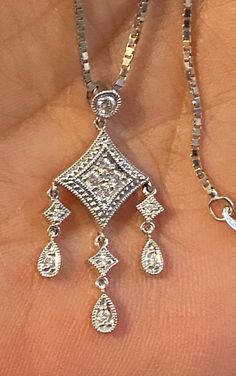 "Solid 14K White Gold Diamond Pendant Necklace 18\" My ex purchased this for me from a jeweler in NYC and it was EXPENSIVE!! STUNNING diamond pendant crafted beautifully in 14k White gold and genuine diamonds! The pendant measures approximately 1 1/4 long x 1/2\" wide. Chain is a nice weight box chain, 18\" long. 4.6 grams total weight. GREAT DEAL!! Please message me with any questions Shipped insured/delivery confirmation I guarantee item to be exactly as described and pictured." Diamond-shaped Diamond Necklace For Anniversary, Elegant Diamond Dangle Necklace For Anniversary, Elegant Dangle Diamond Necklace For Anniversary, Hallmarked Diamond White Pendant Necklace, Dazzling Diamond Cut Pendant Necklace, Brilliant Cut Diamond-shaped Necklace For Anniversary, Anniversary Diamond-shaped Necklace With Diamond Accents, Hallmarked Diamond Pendant Necklace For Anniversary, Diamond-shaped Necklace With Diamond Accents For Anniversary