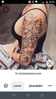 a woman's arm with flowers on it and an instagramr above her