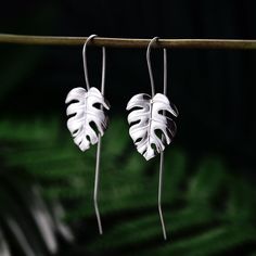 Inspired by the beauty of our nature incorporating flowers, leaves and natural gemstones meticulously handcrafted to match your unique style. This beautiful set of earrings will turn heads and will surely stand out from the usual designs. Made 100% uniquely using the highest quality materials and natural stones. Don’t compromise on quality, sustainability and individuality!MATERIALSMetal Type: SilverWeight: 3.86gMetal Stamp: 925, Sterling Fine Polishing Lead-free Nickel-free Affordable Top-quali Plant Jewelry, Motifs Perler, Gold Leaf Earrings, 18k Gold Earrings, Monstera Leaves, Handmade Fine Jewelry, Silver Jewellery Sets, Monstera Leaf, Silver Drop Earrings