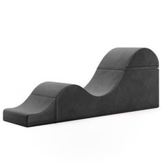 a black chair that is shaped like a wave on the back of it's seat