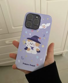 a person holding up a phone case with a bear on it