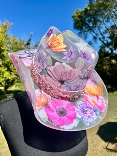 This is a wearable hat. If you're looking for a show stopping piece, something incredibly unique, and one of a kind, this is the one! It's the same size as my standard one size hats, however because it's acrylic, no adjustable tie to make size smaller. Flowers are these beautiful fine line stickers and all greenery is hand painted. It's all coated in a think layer of resin to protect design. Custom Multicolor Hat With Curved Brim, Custom Wide Brim Multicolor Hat, Custom Multicolor Wide Brim Hat, Custom Multicolor Brimmed Hat, Custom Multicolor Flat Brim Hats, Unique Hat For Rodeo And Kentucky Derby, Unique Hats For Kentucky Derby, Unique Hats For Kentucky Derby And Country Events, Whimsical Hat For Kentucky Derby