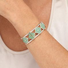 Jay King Gallery Collection Alicia Turquoise Inlay Cuff Bracelet  Gorgeous, green Alicia turquoise inlaid in a fun, geometric design, gives this handcrafted, sterling silver cuff bracelet a chic, contemporary vibe. From Jay's exclusive Gallery Collection.       Approx. 6-3/4"L x 3/4"W; fits 6" to 7" wrist     Stamped .925     Split-top cuff bracelet has green turquoise triangles inlaid in square pattern across top     Sides taper to ends   Stone Information       All sizes and weights approximat Modernist Turquoise Jewelry Gift, Modern Green Bangle Jewelry, Modern Green Bangle, Geometric Green Jewelry Gift, Green Geometric Jewelry For Gifts, Green Geometric Jewelry Gift, Green Geometric Jewelry For Gift, Modern Green Geometric Jewelry, Modern Turquoise Bracelet Jewelry