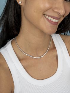 The tennis necklace that doesn't flip! Tennis jewelry is a piece for a lifetime! This tennis necklace is the ultimate symbol of luxury. The leMel tennis necklace is designed not to flip, so your diamonds can sparkle all day long! It can make a statement on its own, but we love to layer our dainty gold jewelry! Add any piece of initial jewelry or even a paperclip chain necklace! Also available with eternity diamond coverage. For custom orders or quotes please email: hello@shoplemel.com White Timeless Tennis Necklace With Single Cut Diamonds, Timeless White Tennis Necklace With Single Cut Diamonds, White Gold Tennis Necklace With Single Cut Diamonds, Timeless Single Strand Diamond White Tennis Necklace, White Gold Tennis Necklace With Single Strand, White Gold Single Strand Tennis Necklace, Timeless White Brilliant Cut Tennis Necklace, White Diamond Single Strand Tennis Necklace, White Gold Single Strand Tennis Necklace For Anniversary