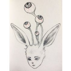 a drawing of a bunny with flowers on its head and two balls in the ears