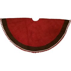 a piece of red and brown cloth with pom poms on the edges, sitting on a white surface