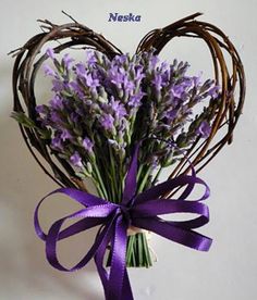 a bunch of lavenders tied together in a heart shape