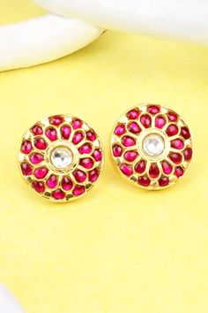 Gold plated round shaped stud earrings with ruby stones and kundan embellishments in floral pattern.
Type: Ruby and Kundan
Composition: Silver
Color: Gold
Other Details: 
Handcrafted
Length (in inches): 1
Weight (in gms): 26
Closure: Push back
Disclaimer: The jewellery is handcrafted therefore variations may occur
 - Aza Fashions Gemstone Round Earrings For Diwali, Round Gemstone Earrings For Diwali, Diwali Gemstone Round Earrings, Festive Bridal Earrings With Gemstones, Round Earrings With Stone Setting For Festivals, Diwali Round Earrings With Stone Setting, Diwali Earrings With Stone Setting, Festive Round Earrings With Gota Work, Gota Work Earrings For Diwali