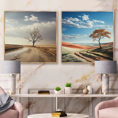 two paintings are hanging on the wall above a coffee table in a room with pink chairs