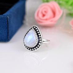 》D E T A I L S《 ✦Stone :- Moonstone ✦Stone Size:-12x15 MM  ✦Stone Shape:- Pear ✦Stone Type:- Natural ✦Metal:- Sterling Silver  ✦Weight:- 5 Gram (Approx) ✦Ring Size:- All Size Available 》C U S T O M I Z E O R D E R《 We accept custom and personalized order. It can be change in the gemstone, earring design and earring size. Please send us message if you are interested in a custom creation. 》 P A C K A G I N G 《 Your jewelry will be nicely packaged. If one or more items are gifts, please leave us a Bohemian White Rings With Large Stone, White Crystal Birthstone Ring As Gift, White Crystal Birthstone Ring For Gift, Gift White Opal Gemstone Ring, White Jewelry With Gemstone Setting As A Gift, White Round Crystal Ring Gift, White Jewelry With Stone Setting Gift, Bohemian White Moonstone Ring With Natural Stones, White Ethical Gemstone Rings For Gift