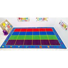 a colorful play mat with the words today on it and an empty box behind it