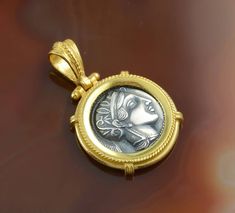 "Athena coin silver golden pendant, Athena pendant, Athena necklace, coin necklace, antique coin pendant, greek pendant, ancient coin, Athena \"Athena\" is a beautiful pendant - a silver ancient coin in a golden frame. The coin represents the Greek goddess, Athena. Athena is the goddess of wisdom and craft. She is the archetype of a strong, brave woman, boldly striding across life, whose greatest strength is her outstanding intelligence. The reverse of the coin shows the owl - the symbol of Athe Silver Coin Jewelry, Greek Goddess Athena, Ancient Coin Pendant, Gold Coin Jewelry, Coin Frame, Goddess Of Wisdom, Golden Pendant, Goddess Athena, Ancient Greek Coin