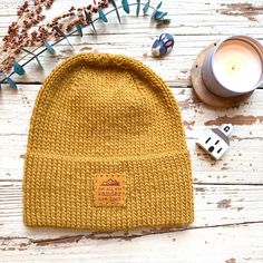 This hand-knit Jake Beanie in mustard yellow fall color  is made of 100% Peruvian Wool which is ethically-sourced. This unisex hat is designed without pom and it is perfect for all occasions. It is attached with tag "Not all who wanders are lost"! Stay warm in this cozy beanie when you are exploring outdoor activities.  *Size : Fits 21-23" head circumference. Beanie may look slightly tall for smaller head. *Hat measurement: Height 9" width 8.75" (folded brim) *Material: ~ 100%  Peruvian Wool in Yellow Beanie, Cozy Beanie, Clean Towels, Man Hat, Beanie Pattern, Fall Color, Skull Cap Beanie, Head Circumference, Skull Cap