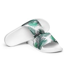 A must-have for the summer: these women’s slides. A pair of these will keep you comfy throughout your day of beach or pool activities, thanks to the cushioned upper strap and the textured footbed. • Cushioned and durable faux leather upper strap • Lightweight polyurethane (PU) outsole • Contoured, textured footbed • Stitched around the upper perimeter for extra durability • Spot clean only • Printed, cut, and handmade • Blank product sourced from China Important: This product is available in the Casual Synthetic Slippers For Vacation, Casual Beach Slides In Synthetic, Lightweight Slip-on Slides For Vacation, Adjustable Lightweight Slide Sandals, White Tropical Flip Flops For Vacation, Tropical White Flip Flops For Vacation, Summer Lightweight Slip-on Slides, Tropical White Vacation Flip Flops, Non-slip Synthetic Flip Flops For Vacation