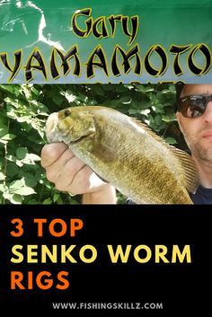 a man holding a large fish in front of a green sign that says 3 top seiko worm rigs