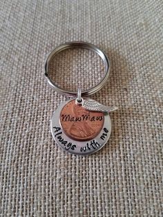 a penny keychain with the words, i love you to the moon and back