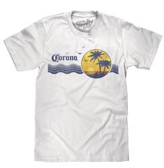 Vintage Never Looked So Good Corona wants you to "find your beach", but don't worry if you can't get away to a tropical destination! We've brought the coast a little closer to you with this vintage beer t-shirt featuring the authentic Corona logo, and an 80s-inspired tropical palm tree graphic complete with shorebirds. To complete the retro look and feel on this Corona shirt - we gave the entire graphic a fun, distressed and faded look and printed it on the highest quality, white cotton tee shir Retro T-shirt With Back Print For Summer, Graphic Tee T-shirt For Beach With Back Print, Graphic Tee T-shirt With Back Print For Beach, Graphic Tee With Back Print For Beach, Graphic Tee With Back Print For The Beach, Vintage Screen Print T-shirt For Vacation, Vintage T-shirt For Beach Vacation, Vintage Pre-shrunk T-shirt For Beach, Palm Tree Logo