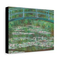 a painting of water lilies and a bridge over a pond canvas wall art print