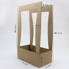 an open cardboard box with handles and sides cut out to show the measurements for each piece