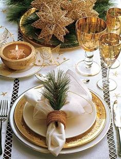 a collage of photos with white and gold decorations, candles, dishes, and napkins