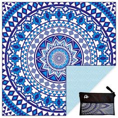 a blue and white circular design with black zippered pouch