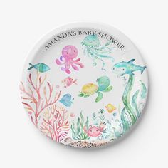 a paper plate with watercolor under the sea animals and fish on it's side