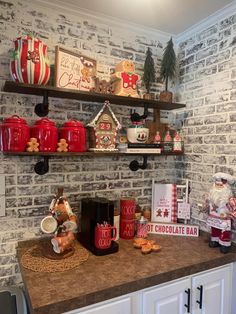 a kitchen counter topped with lots of christmas decorations