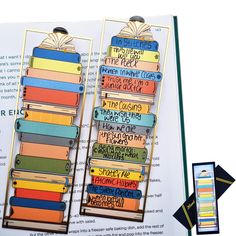 an open book with several colorful books on it and the words in each one are written