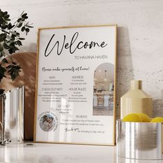 a welcome sign is displayed on a shelf next to vases and other decor items