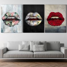 three paintings on the wall of a living room with white couches and a gray sofa