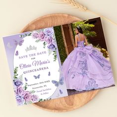 a purple wedding dress and save the date card on a wooden plate with lavender flowers